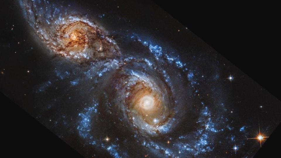 NASA'nın Galaksi Etkileşimleri: NGC 2207 ve IC 2163'ün Kozmik Dansı - OtonomHaber
